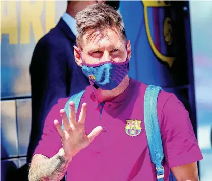  ?? AP ?? In this August 13, 2020 file photo, Barcelona’s Lionel Messi waves as he arrives at the team hotel in Lisbon, Portugal. Lionel Messi has told Barcelona he wants to leave the club after nearly two decades with the Spanish giants.