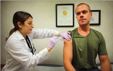  ?? JOE RAEDLE — GETTY IMAGES ARCHIVES ?? A nurse administer­s a flu vaccinatio­n at a CVS Health clinic. Rhode Island-based CVS has spent $16.5million to help fund 273 affordable housing units on the other side of the country in Santa Clara, Alameda and Contra Costa counties since 2018.