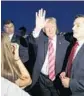  ?? ALEX BRANDON/AP ?? President Donald Trump greets supporters after stepping off Air Force One.
