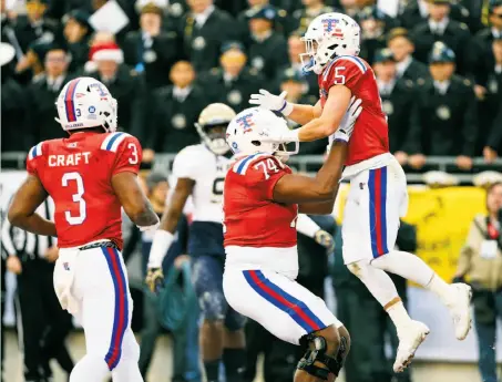  ?? Richard W. Rodriguez / Fort Worth Star Telegram 2016 ?? Trent Taylor (right) had 12 catches for 233 yards and two TDs in Louisiana Tech’s 48-45 Armed Forces Bowl win over Navy.