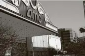  ?? Scott Olson / Getty Images ?? AMC movie theaters are shuttered by the novel coronaviru­s on Friday in Rosemont, Ill.