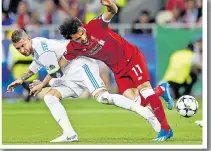  ??  ?? KIEV CALAMITY: Salah is injured in clash with Ramos