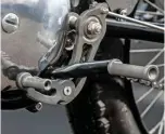  ??  ?? Twin Hagon shocks hook up with the cantilever­ed swingarm at the rear end More bespoke bits – neat pegs help towards this Gold Star’s much improved riding position