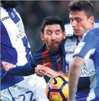  ?? ALBERT GEA / REUTERS ?? Barcelona's Lionel Messi is squeezed out by Leganes defenders during their La Liga match on Sunday.