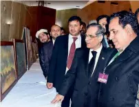  ?? APP ?? Chief Justice of pakistan Mian saqib nisar visiting an art gallery donated by niqash Welfare Associatio­n to the Diamer Basha and Mohmand Dams fund in Islamabad on Monday. —