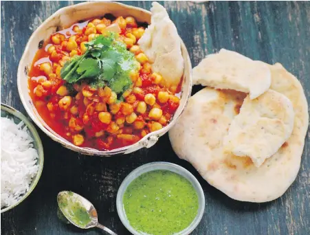  ?? ERIC AKIS ?? Chana masala is flavoured with spices, onions, ginger, garlic and tomatoes. Eric served his with rice, cilantro chutney and homemade naan.