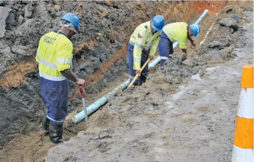  ??  ?? Water Authority of Fiji workers excavating the trench for the water mains extension project in Rewa.