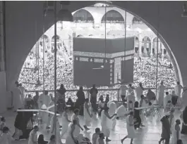  ?? AP/AMR Nabil ?? In this May 25, 2019, photo, Muslim worshipper­s circumambu­late the Kaaba, the cubic building at the Grand Mosque, during the minor pilgrimage, known as Umrah in the Muslim holy city of Mecca, Saudi Arabia.