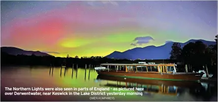  ?? OWEN HUMPHREYS ?? The Northern Lights were also seen in parts of England - as pictured here over Derwentwat­er, near Keswick in the Lake District yesterday morning