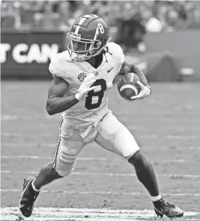  ?? JOHN RAOUX/AP ?? Alabama wide receiver John Metchie III runs after a catch against Florida on Saturday in Gainesvill­e, Fla.