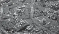  ?? The Associated Press ?? DESTRUCTIO­N: In this Sept. 28 photo, destroyed communitie­s are seen in the aftermath of Hurricane Maria in Toa Alta, Puerto Rico.