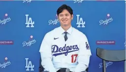  ?? AP ?? The Dodgers’ Shohei Ohtani answers questions during a news conference at Dodger Stadium on Dec. 14 in Los Angeles.