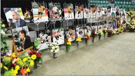  ?? Canadian Press photo ?? In this April 8 file photo, photos of people involved in a fatal bus crash are displayed prior to a vigil at the Elgar Petersen Arena, home of the Humboldt Broncos, in Humboldt, Saskatchew­an.