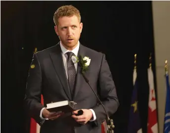  ?? Government of Nova Scotia photo ?? Nova Scotia’s new Premier Iain Rankin at the swearing-in of his cabinet on February 23. While Nova Scotia has contained the pandemic in the Atlantic Bubble, the unhappy experience of the Newfoundla­nd election shutdown is a constraint against an early call to the polls.