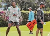  ?? Susan Stocker/TNS ?? Miami Dolphins cornerback Byron Jones, left, pictured rehabbing last June, tweeted Saturday about why he could never suit up in the 2022 season.