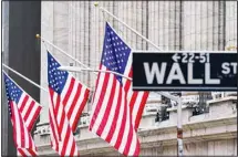  ??  ?? In this file photo, American flags hang outside of the New York Stock Exchange. The White House believes it has an ally in the bond markets to make the case that inflation isn’t an economic threat. (AP)