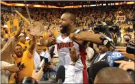  ?? STAFF FILE PHOTO ?? The Warriors’ Baron Davis is surrounded by fans and media after helping beat the Mavericks 111-86in Game 6of the NBA Western Conference first-round playoffs at Oracle Arena on May 3, 2007.