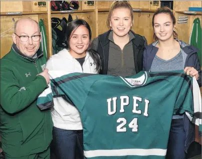  ?? JASON MALLOY/THE GUARDIAN ?? The UPEI Panthers have landed a trio of Islanders for the 2018-19 season. From left are head coach Bruce Donaldson, Parker McCabe, Kelly Clements and Taylor Gillis.