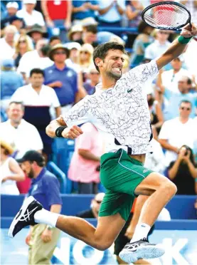  ?? Photo: AP ?? Djokovic reacts after beating Federer