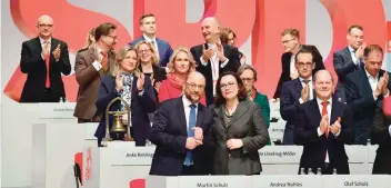  ?? — AFP ?? Leader of the Social Democratic Party (SPD), Martin Schulz (front, L) is applauded after delivering a speech during a party congress of Germany’s Social Democrats in Berlin on Thursday.