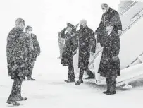  ?? Carolyn Kaster / Associated Press ?? President Joe Biden arrives on Air Force One at Joint Base Andrews in suburban Maryland. Snow grounded Biden’s helicopter, so a motorcade took him to the White House.