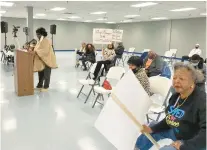  ?? TED SLOWIK/DAILY SOUTHTOWN ?? Mildred Morgan listens Tuesday as Star Lawson speaks at the University Park Village Board meeting.