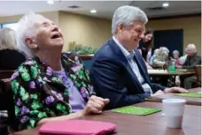  ?? ADRIAN WYLD/THE CANADIAN PRESS ?? Donna DeMarsh plays bingo with Conservati­ve Leader Stephen Harper.