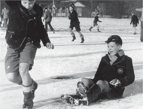  ??  ?? Give it some wellie: Britain froze in the early months of 1947, but these Derby schoolboys are having a great time