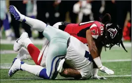  ?? ASSOCIATED PRESS ?? ATLANTA FALCONS DEFENSIVE END Adrian Clayborn (99) sacks Dallas Cowboys quarterbac­k Zac Dysert (4) during the second half of Sunday’s game in Atlanta.