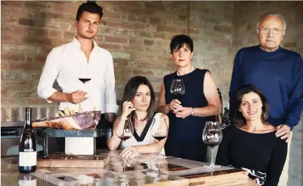  ?? ?? THE GREAT Angelo Gaja with his family. They run their wineries and their distributi­on business in Italy.