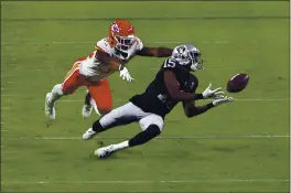  ?? DAVID BECKER — THE ASSOCIATED PRESS ?? Las Vegas Raiders receiver Nelson Agholor (15) attempts a reception under pressure from Kansas City Chiefs cornerback Charvarius Ward (35) on Sunday, Nov. 22, in Las Vegas.