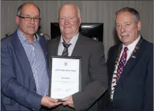  ??  ?? Andy Dodd and Cathaoirle­ach of Sligo County Council, Cllr. Seamus Kilgannon presenting Tony Quinn with Spirit of Sligo Rovers Award.