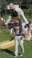  ?? PETE BANNAN — DIGITAL FIRST MEDIA ?? Marple Newtown’s Andrew Cantwell leap frogs Steve Morrison after the Tigers came from behind in the fifth inning to defeat Wissahicko­n 3-1 in the District 1 Class 5A semis.