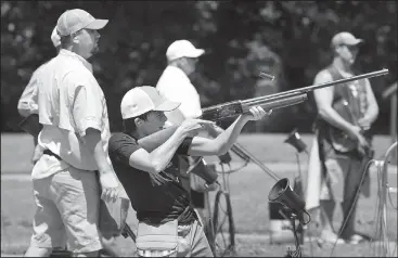  ?? NWA Democrat-Gazette/BEN GOFF • @NWABENGOFF ?? Hunter Hanna, 13, of Hot Springs fires at a clay target Friday during the Poultry Festival trap competitio­n at the Bella Vista Property Owners Associatio­n gun range. The annual festival is a fundraiser for The Poultry Federation, and includes a golf...