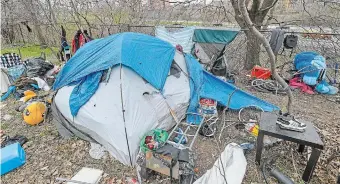  ?? GARY YOKOYAMA THE HAMILTON SPECTATOR ?? An occupied tent beside Kay Drage Park in Hamilton. The city’s COVID-19 strategy must include plans to protect and help our most vulnerable citizens, two doctors write.