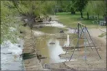  ?? GARY NYLANDER/The Daily Courier ?? Gabion barriers are set up along Rotary Beach Park onWednesda­y.Therisingw­atersofOka­naganLake are invading the park.