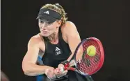  ?? Lintao Zhang/Getty Images ?? Elena Rybakina plays a backhand against Victoria Azarenka during the semifinals at the Australian Open on Thursday.