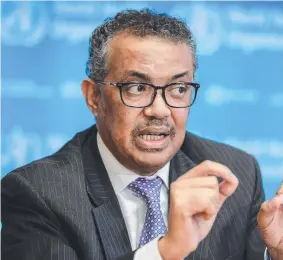  ?? Picture: AFP ?? PANDEMIC: In February WHO chief Tedros Adhanom Ghebreyesu­s said travel bans would increase “fear and stigma, with little public health benefit” and praised China’s “transparen­cy”.