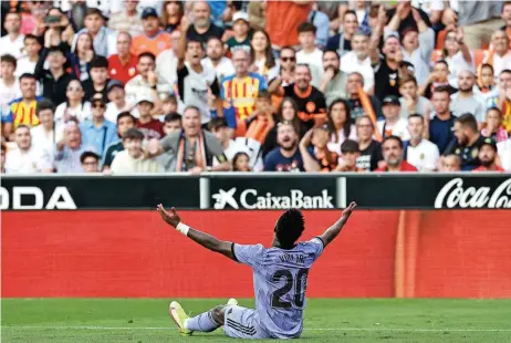  ?? ?? real Madrid's Vinicius Junior gestures to the crowd during their Spanish league match against Valencia at the Mestalla stadium in Valencia on Sunday (AFP)