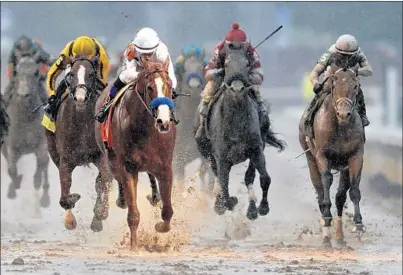  ?? DARRON CUMMINGS/AP ?? Mike Smith rides Justify to victory during the 144th running of the Kentucky Derby on May 5 in Louisville, Ky.