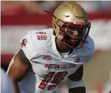  ?? AP FILE ?? HEADING HOME: Boston College linebacker Isaiah Graham-Mobley plays against UMass on Saturday.