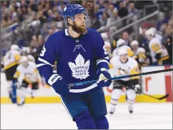  ?? Canadian Press photo ?? Toronto Maple Leafs newly acquired defenceman Jake Muzzin (8) looks down ice during first period NHL hockey action against the Pittsburgh Penguinsin Toronto on Saturday.