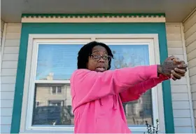  ?? AP ?? Briana Tyler uses her hands like a gun as she demonstrat­es the gunman shooting indiscrimi­nately, as she talks about witnessing the mass shooting at a Walmart yesterday.