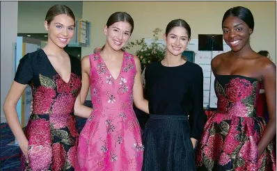  ??  ?? Shelby Steplock of Greenbrier; Sofiya Stasiv and Sydney McEwen, both of Conway; and Mercedes Bell of Fayettevil­le, all wearing dresses by Carolina Herrera