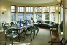  ?? JONATHAN WALLEN — THE MONACELLI PRESS VIA AP ?? This undated photo provided by The Monacelli Press shows a photograph of a dining room in a house on Penobscot Bay, Maine, featured in the book .