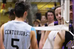  ?? Eddy Martinez/The Signal (See additional photos on signalscv.com) ?? The Valencia and Saugus boys volleyball teams work their way through the handshake line after their match at Valencia on Tuesday. The Vikings swept the Centurions 3-0.