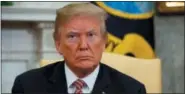  ?? EVAN VUCCI, FILE - THE ASSOCIATED PRESS ?? In this April 10, 2018, file photo, President Donald Trump listens as he meets in the Oval Office of the White House, in Washington. Trump said Thursday, April 12, that an attack on Syria could take place “very soon or not so soon at all!”