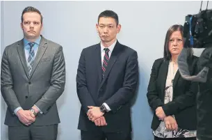  ?? RENÉ JOHNSTON TORONTO STAR FILE PHOTO ?? Toronto police Det. Const. Dennis Yim, centre, seen with colleagues Brandon Price and Kristy Devine, is the gatekeeper of informatio­n on the investigat­ion into the Sherman murders.