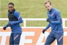  ?? — AFP ?? England’s forwards Harry Kane (R) and Raheem Sterling take part in England’s MD-1 training session at St George’s Park in Burton-on-trent, central England.