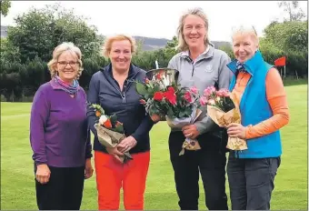  ?? ?? Charlie Taylor with the Ladies Eric Wood Memorial trophy and the other Whiting Bay players. trophy.